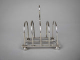 Sterling Silver Five Bar Toast Rack by William Hutton & Sons, Sheffield, 1907. - Harrington Antiques